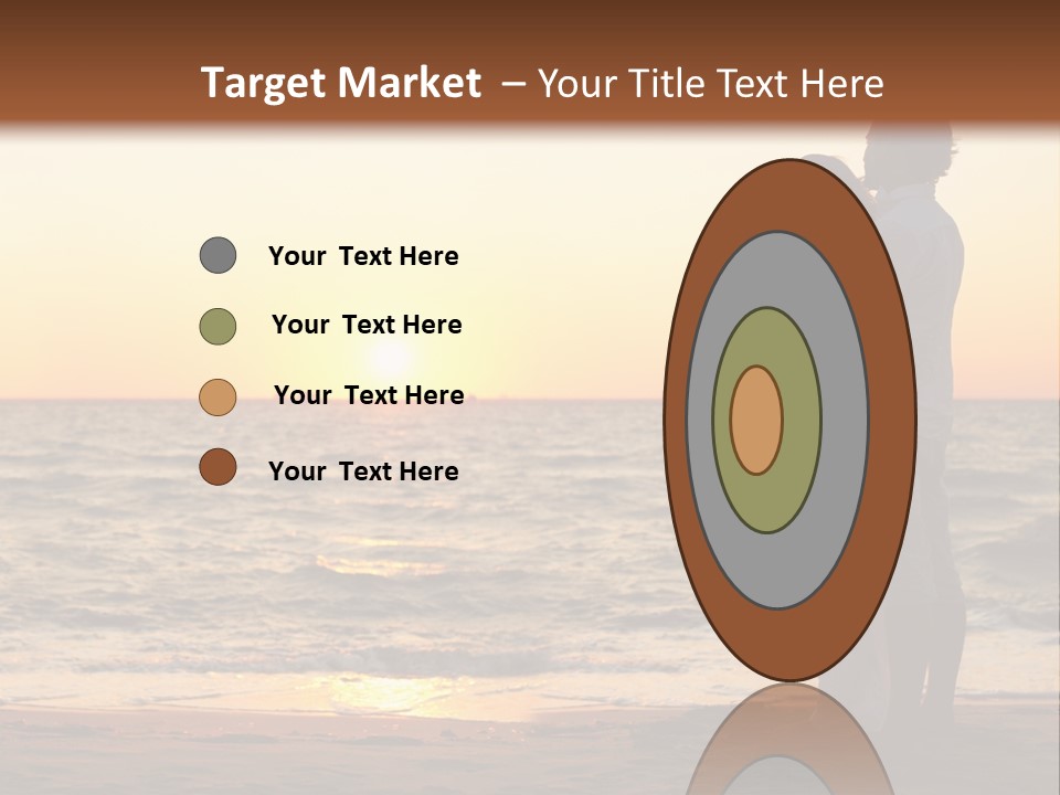 Two People Standing On A Beach At Sunset PowerPoint Template