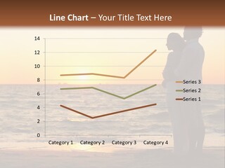 Two People Standing On A Beach At Sunset PowerPoint Template