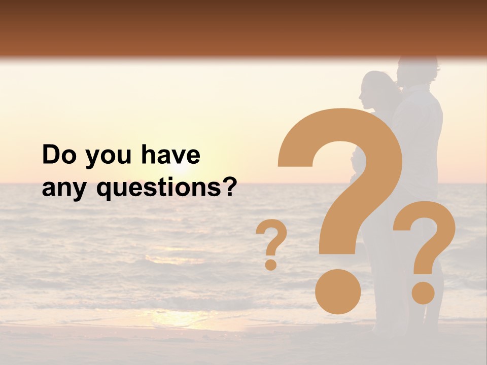 Two People Standing On A Beach At Sunset PowerPoint Template