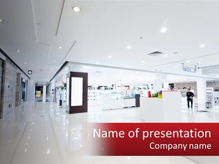 A Person Standing In A Large White Room PowerPoint Template