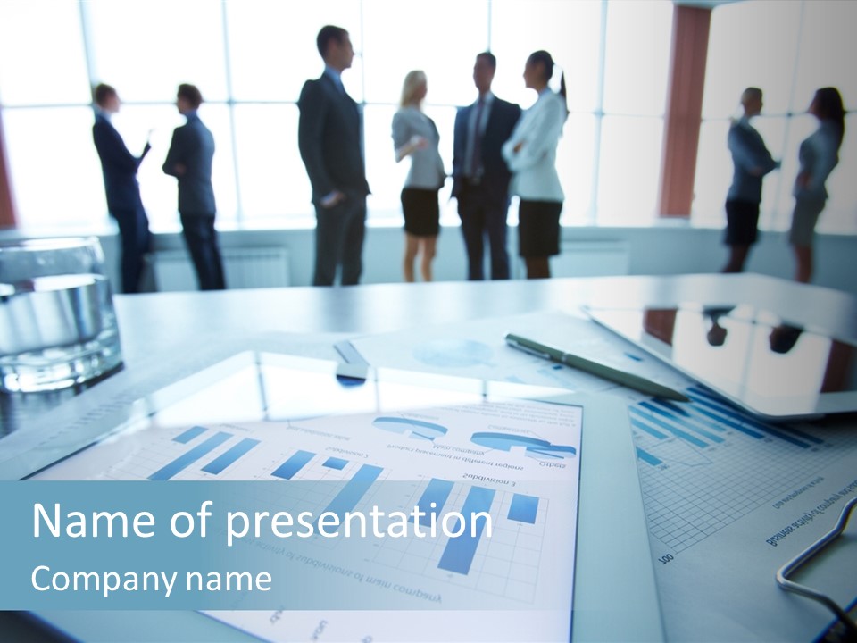 A Group Of Business People Standing Around A Table PowerPoint Template