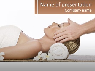 A Woman Getting A Facial Massage With A Towel On Her Head PowerPoint Template