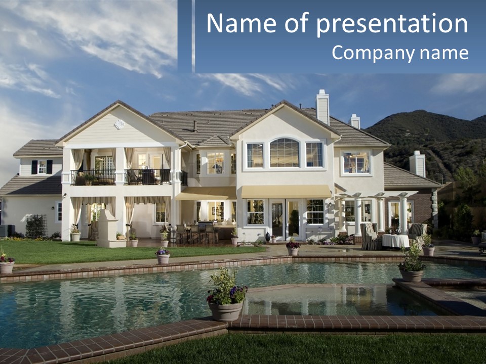 A Large White House With A Pool In Front Of It PowerPoint Template