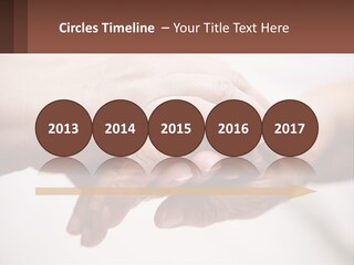 A Group Of People Holding Hands In A Circle PowerPoint Template