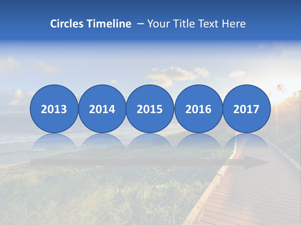 A Boardwalk Leading To The Beach With The Ocean In The Background PowerPoint Template