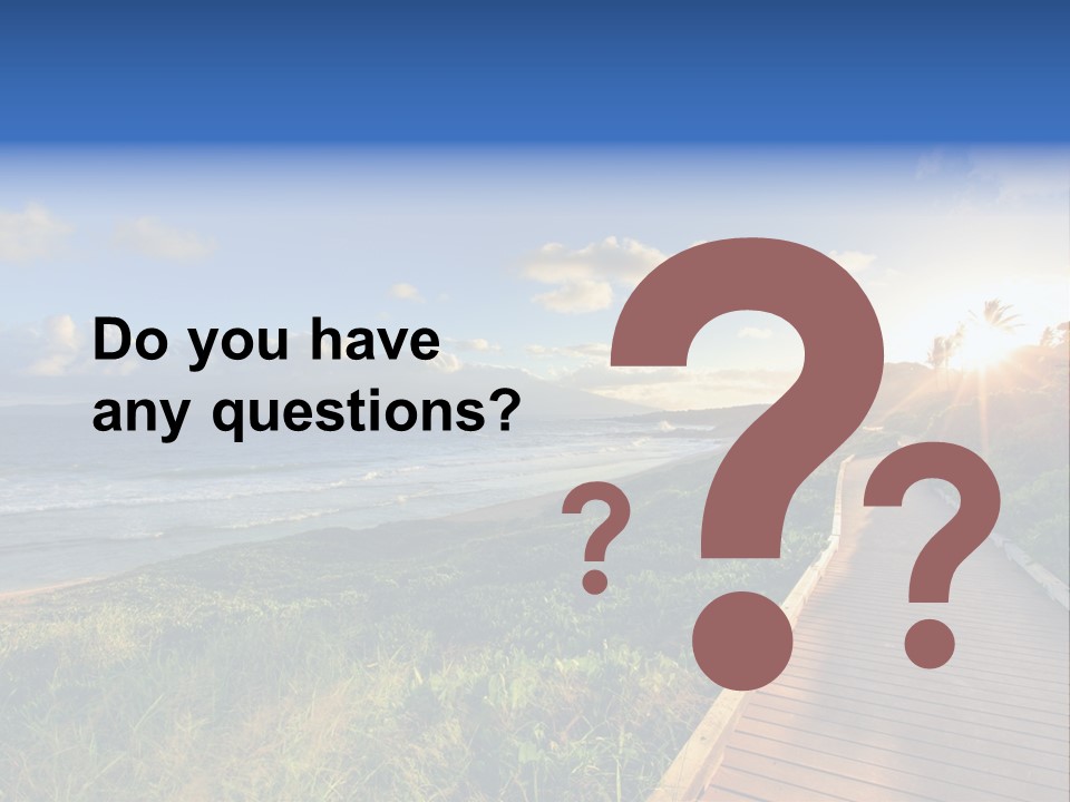 A Boardwalk Leading To The Beach With The Ocean In The Background PowerPoint Template