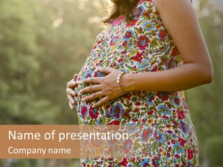 A Pregnant Woman In A Colorful Dress Is Holding Her Belly PowerPoint Template