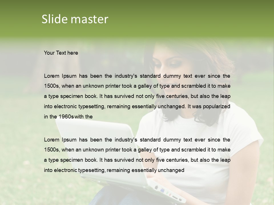 A Woman Sitting In The Grass Using A Laptop Computer PowerPoint Template