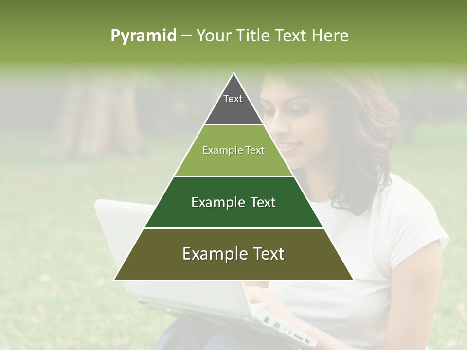 A Woman Sitting In The Grass Using A Laptop Computer PowerPoint Template