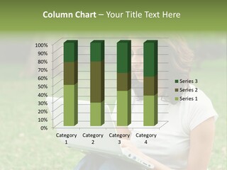 A Woman Sitting In The Grass Using A Laptop Computer PowerPoint Template