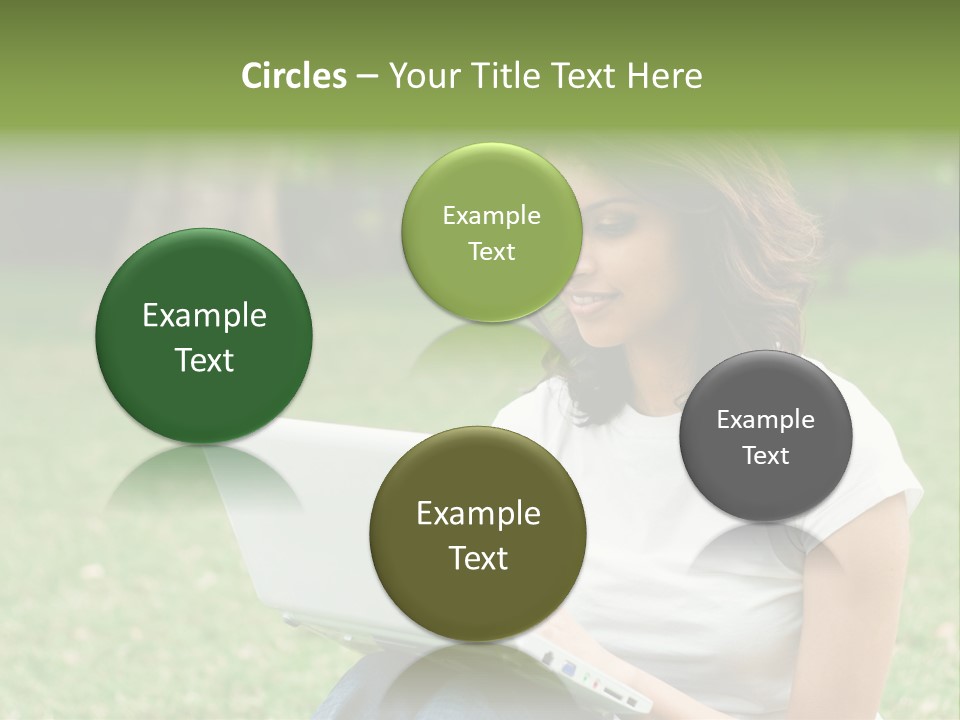A Woman Sitting In The Grass Using A Laptop Computer PowerPoint Template
