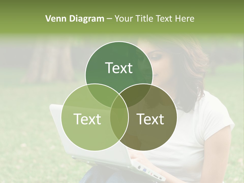 A Woman Sitting In The Grass Using A Laptop Computer PowerPoint Template