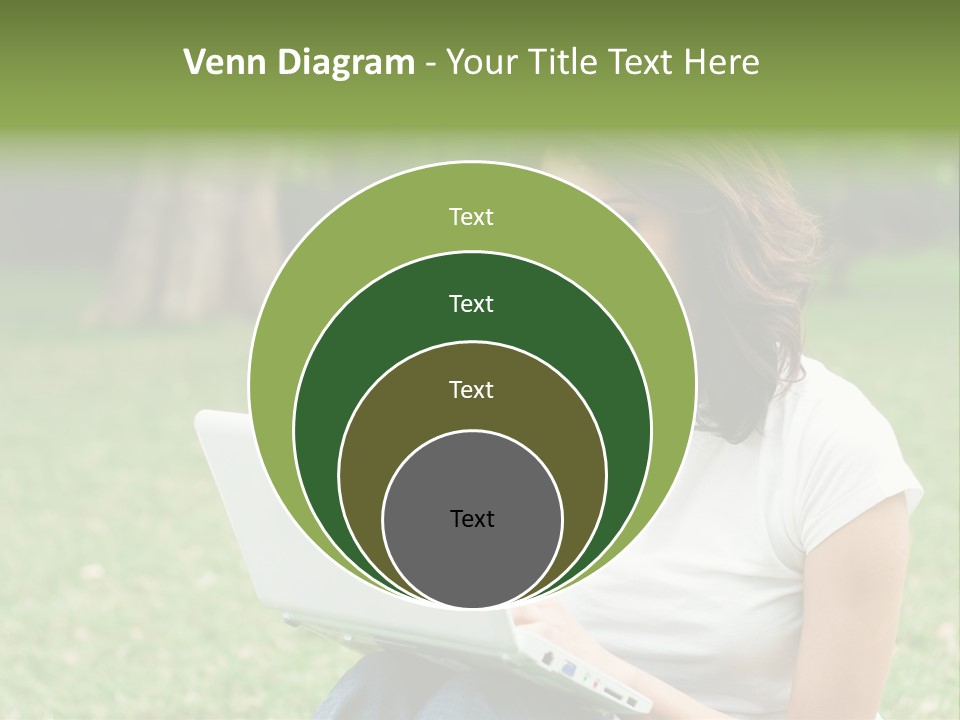A Woman Sitting In The Grass Using A Laptop Computer PowerPoint Template