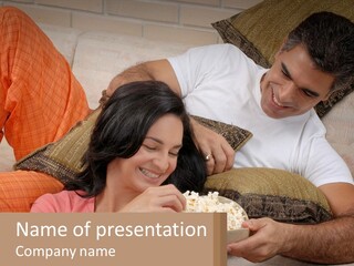 A Man And Woman Sitting On A Couch Eating Popcorn PowerPoint Template