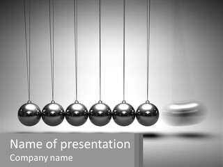 A Group Of Balls Hanging From Strings In A Room PowerPoint Template