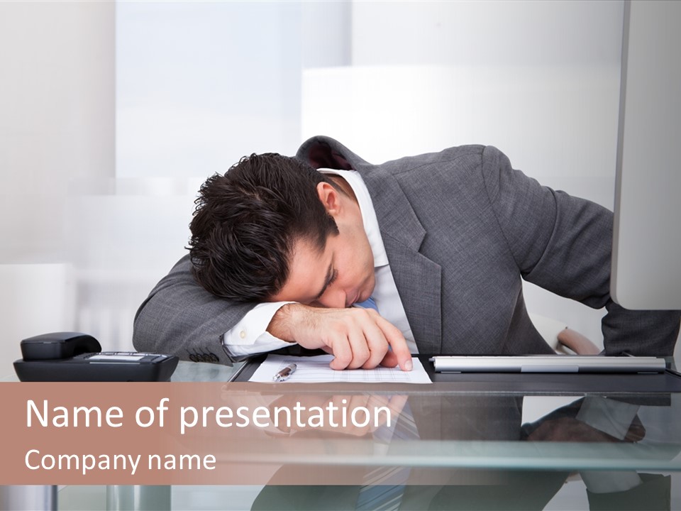 A Man In A Suit Sleeping On A Desk PowerPoint Template