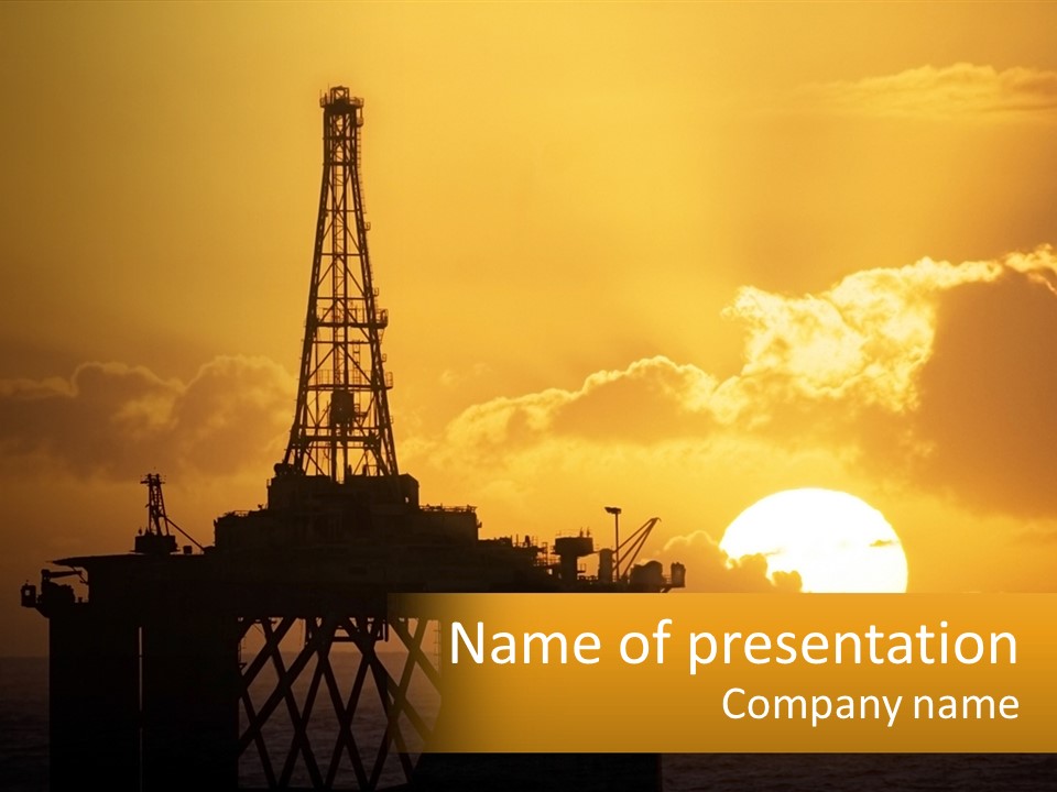 An Oil Rig In The Middle Of The Ocean At Sunset PowerPoint Template