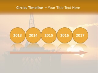 An Oil Rig In The Middle Of The Ocean At Sunset PowerPoint Template