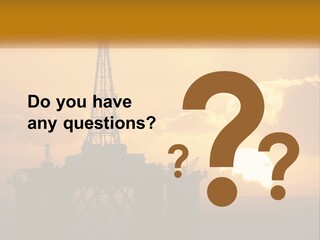 An Oil Rig In The Middle Of The Ocean At Sunset PowerPoint Template