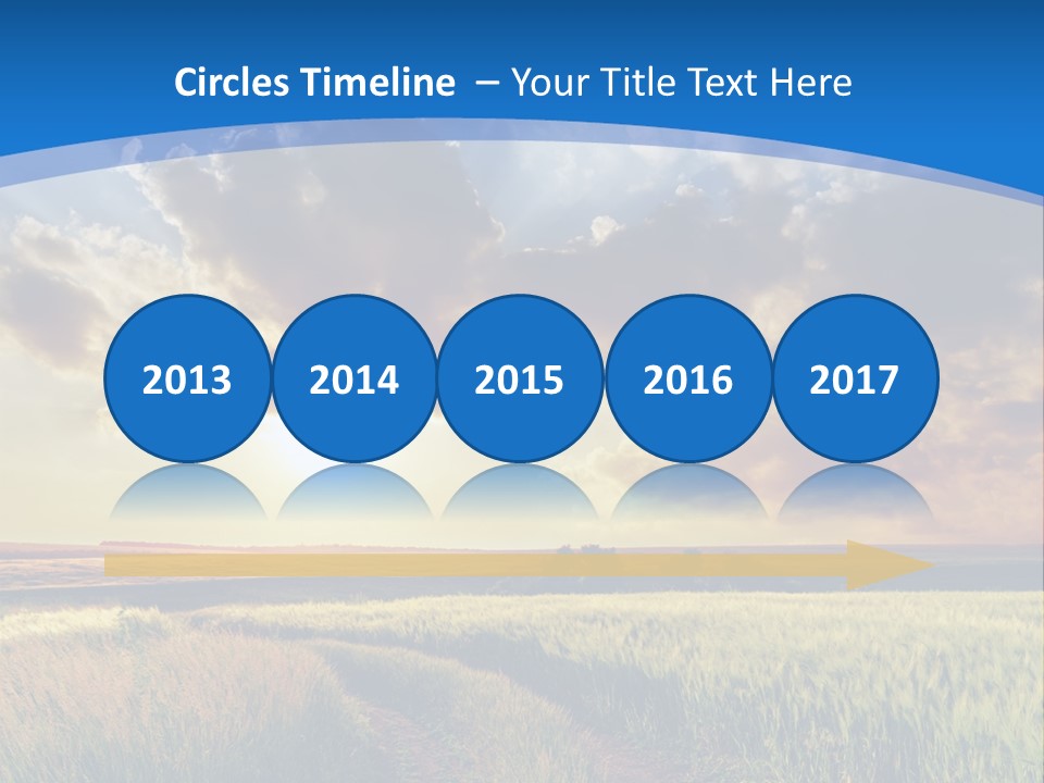 A Sunset Over A Field With A Dirt Road In The Foreground PowerPoint Template