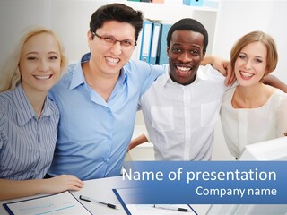 A Group Of People Standing Around A Table PowerPoint Template