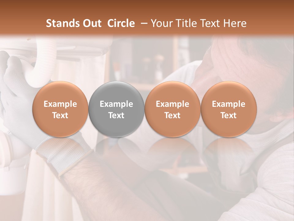 A Man Working On A Pipe In A Kitchen PowerPoint Template