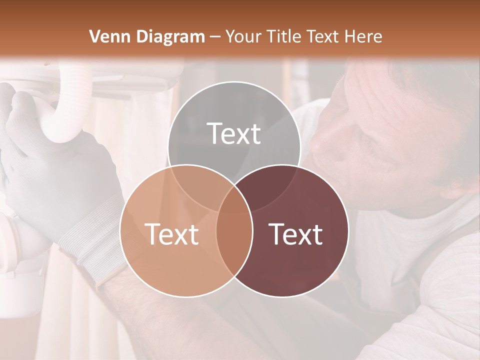 A Man Working On A Pipe In A Kitchen PowerPoint Template