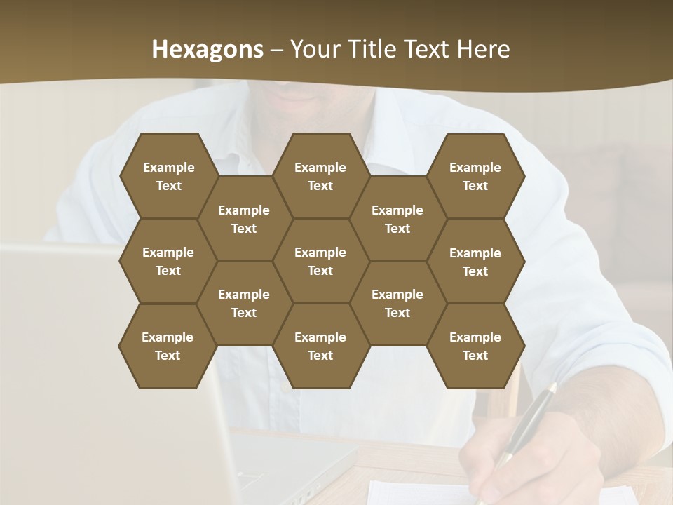 A Man Sitting At A Desk Writing On A Piece Of Paper PowerPoint Template