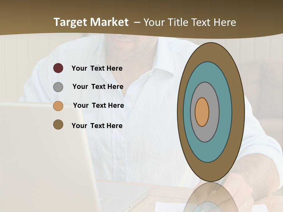 A Man Sitting At A Desk Writing On A Piece Of Paper PowerPoint Template