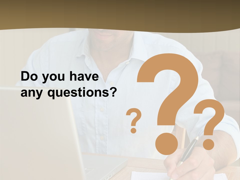 A Man Sitting At A Desk Writing On A Piece Of Paper PowerPoint Template