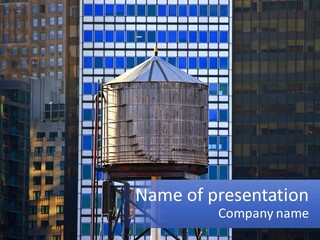 A Water Tower In Front Of A Tall Building PowerPoint Template