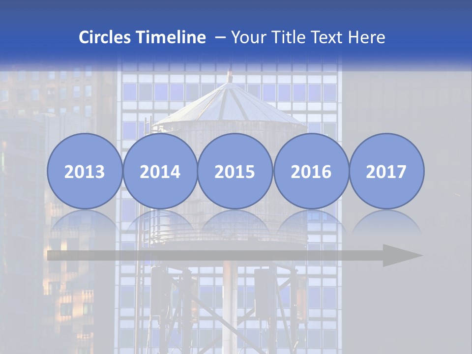 A Water Tower In Front Of A Tall Building PowerPoint Template