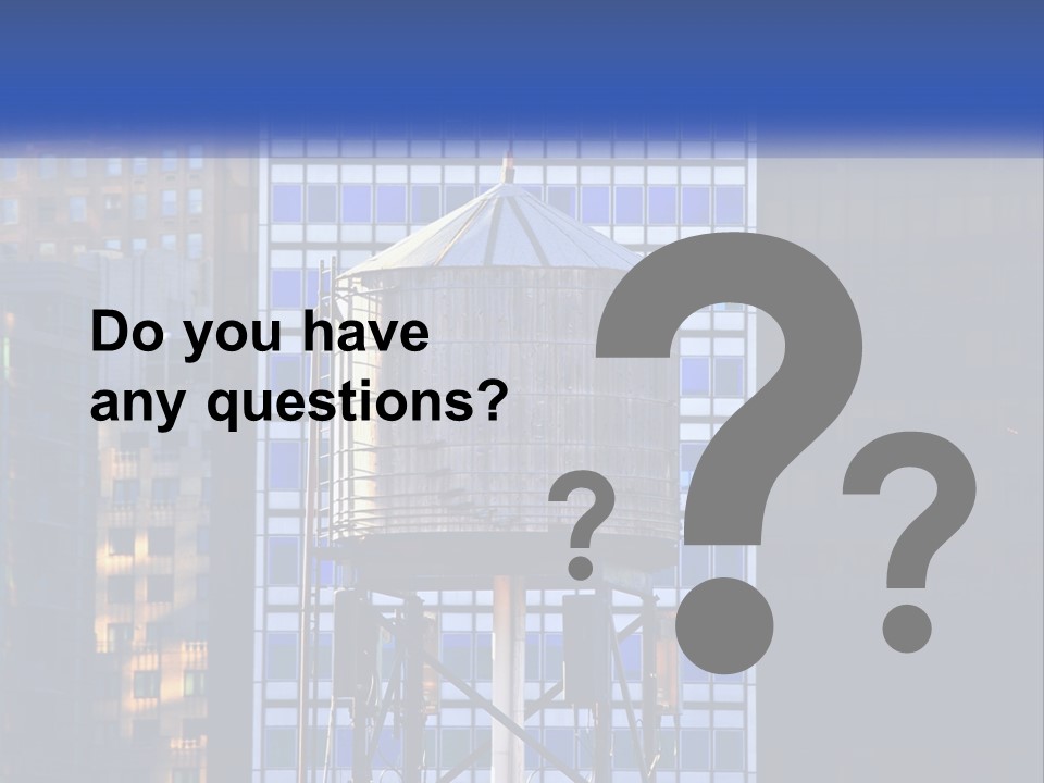 A Water Tower In Front Of A Tall Building PowerPoint Template