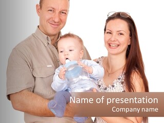 A Man And Woman Holding A Baby In Their Arms PowerPoint Template