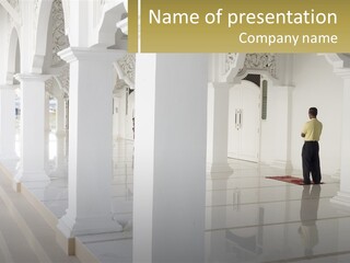 A Man Standing In A Room With Columns PowerPoint Template