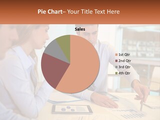 A Couple Of People Sitting At A Table With Papers PowerPoint Template