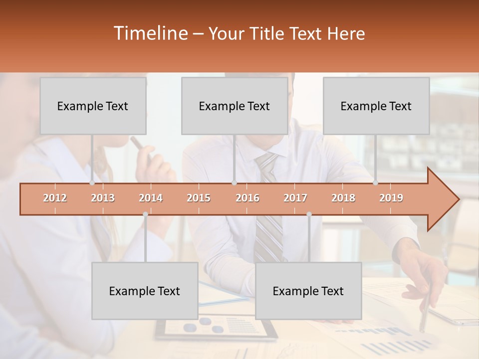 A Couple Of People Sitting At A Table With Papers PowerPoint Template
