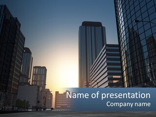 A Group Of Skyscrapers With The Sun Setting In The Background PowerPoint Template