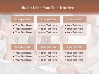 A Group Of Business People Looking At Something On A Table PowerPoint Template
