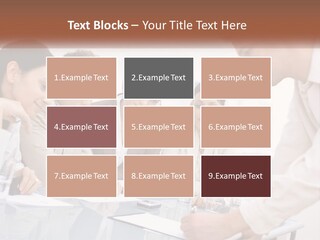 A Group Of Business People Looking At Something On A Table PowerPoint Template