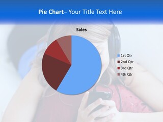 A Woman Wearing Headphones Is Looking At Her Cell Phone PowerPoint Template