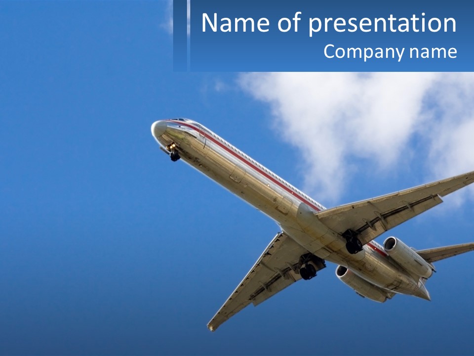 A Large Commercial Airplane Flying In The Sky PowerPoint Template