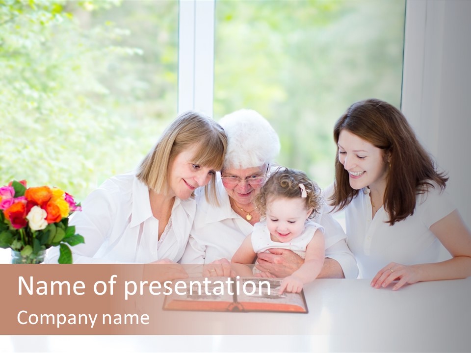 A Group Of People Sitting Around A Table With A Baby PowerPoint Template