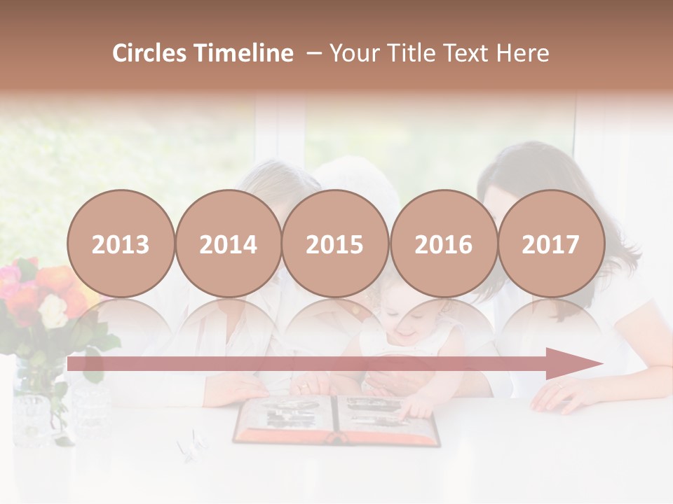 A Group Of People Sitting Around A Table With A Baby PowerPoint Template