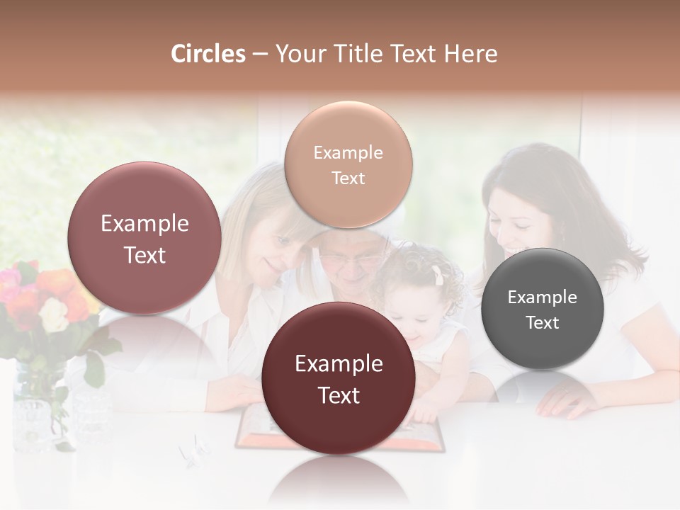 A Group Of People Sitting Around A Table With A Baby PowerPoint Template