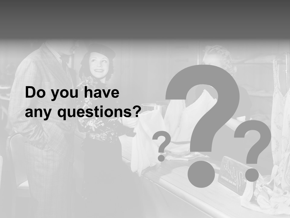 A Man And Two Women Standing In Front Of A Table PowerPoint Template