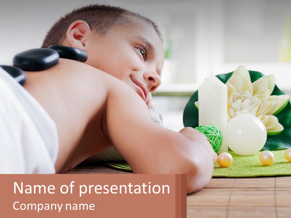 A Young Boy Laying On A Table Next To A Flower Powerpoint Presentation PowerPoint Template