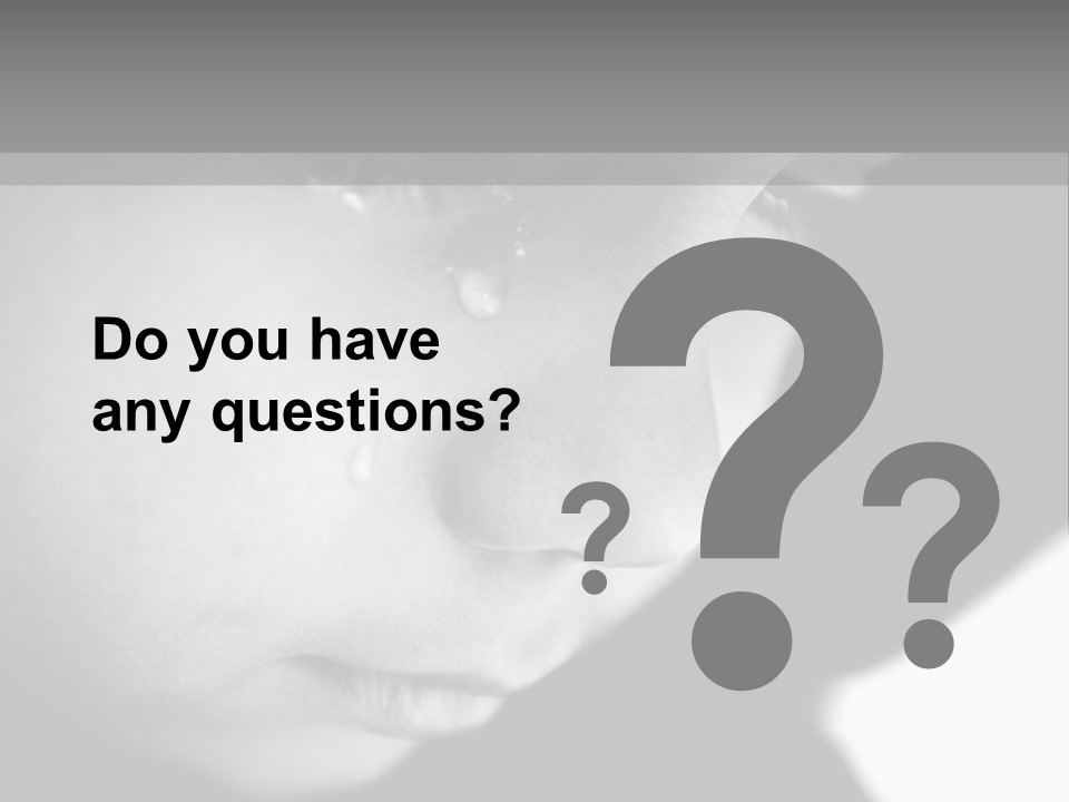 A Young Boy Is Looking Down At His Cell Phone PowerPoint Template