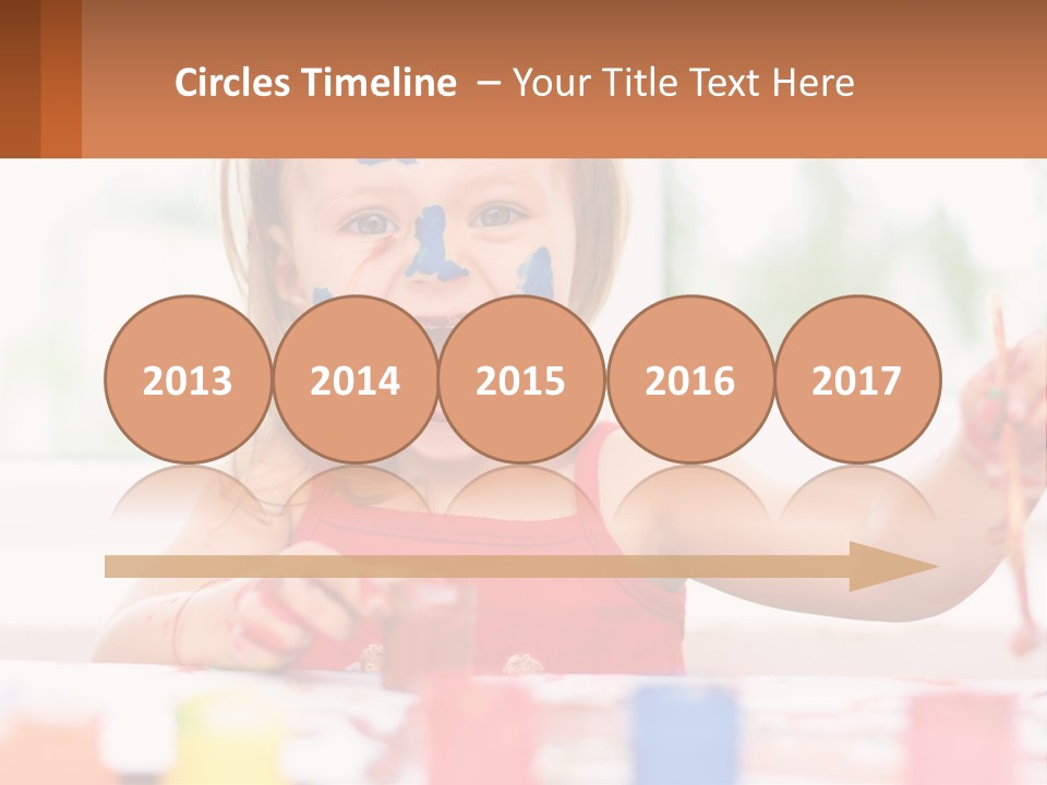 A Little Girl With Her Face Painted Blue And Red PowerPoint Template