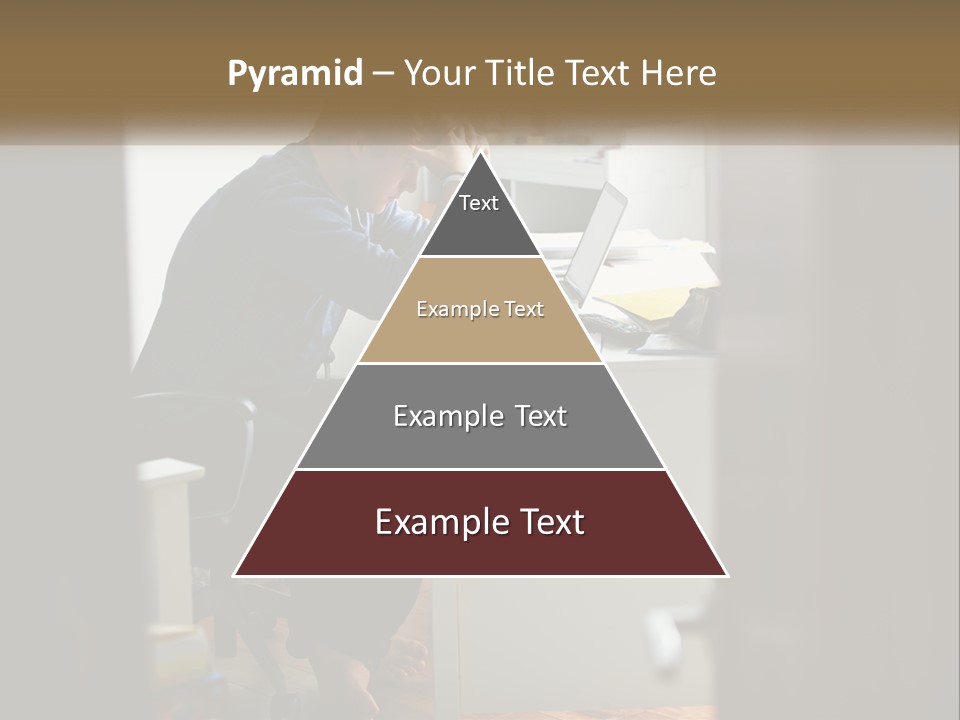 A Man Sitting At A Desk In Front Of A Laptop Computer PowerPoint Template
